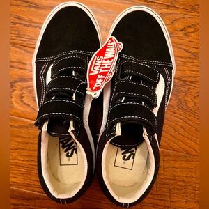 Size 4.5 M (6 W) NWT Vans Sk8 Lo. Black and white Velcro for easy on and off.